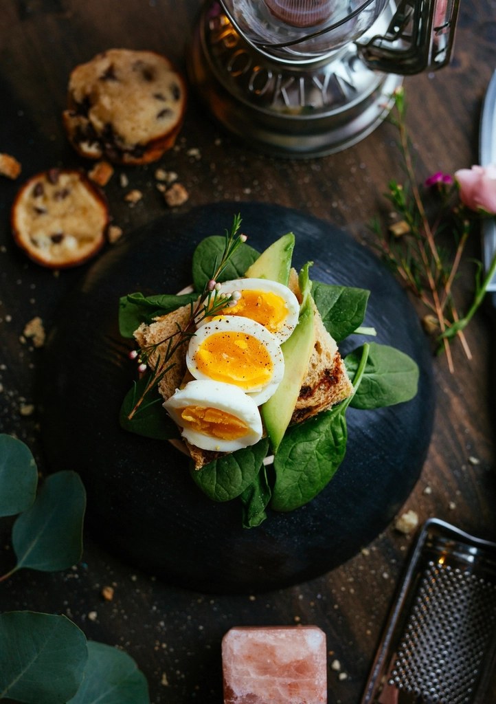 Avocado toast with boiled eggs and spinach