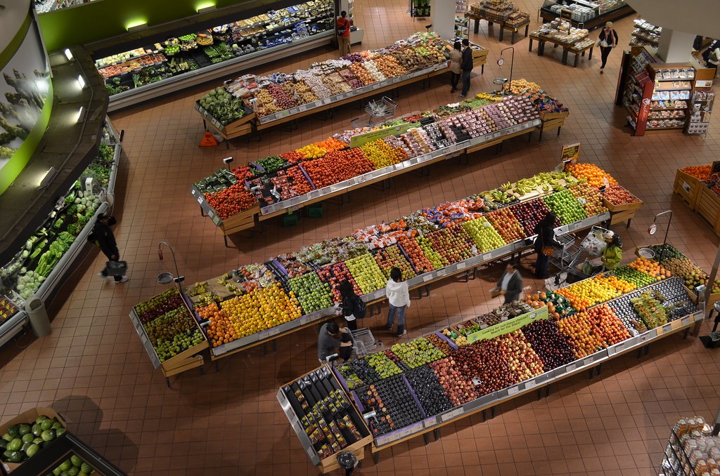Produce section of a grocery store seen from above