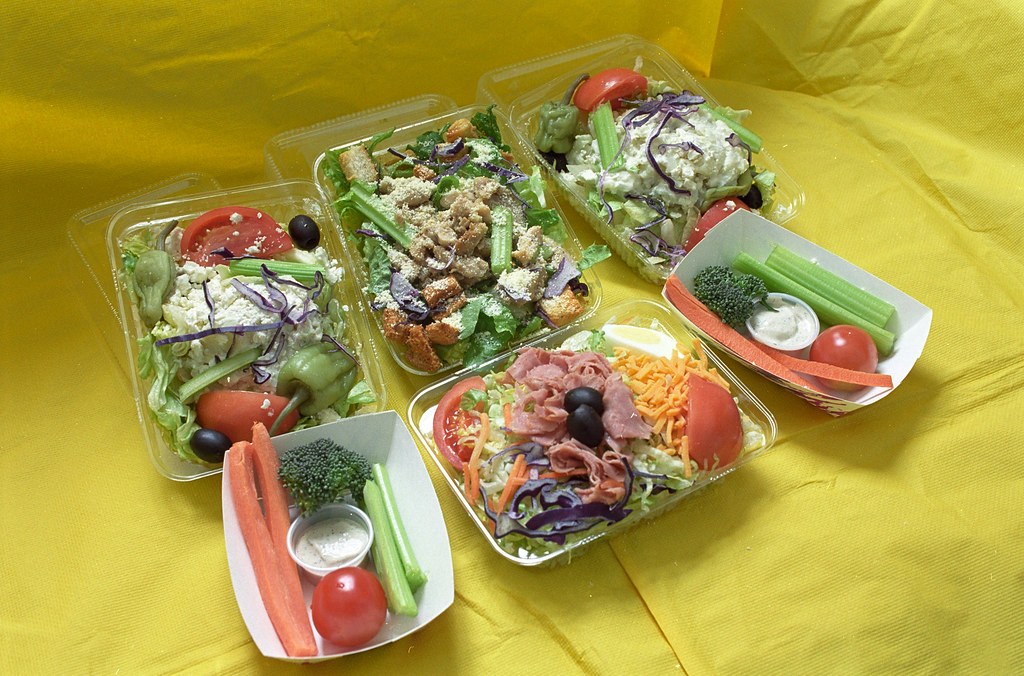 Fresh salads and vegetable snacks in to-go containers